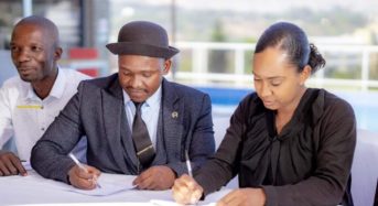 Sukali and Amaryllis Hotel representative signing an agreement