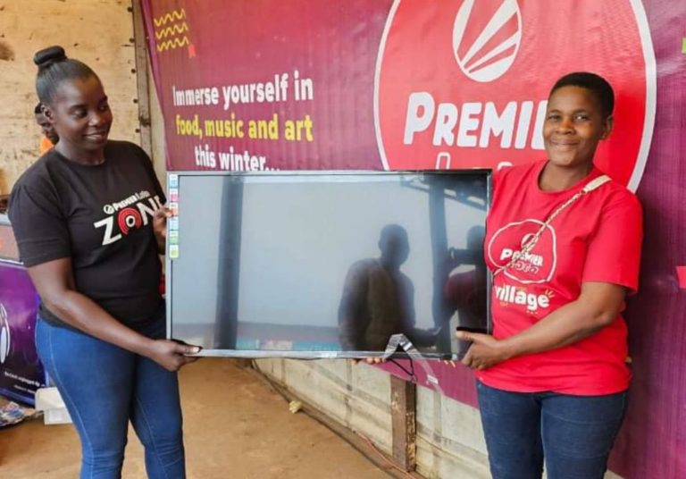 Liquor seller wins two  plasma TV screens in Premier Lotto Village promotion