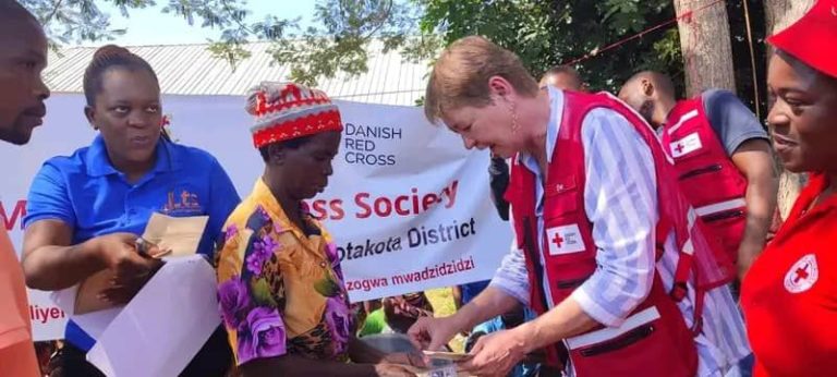 International Federation of Red Cross (IFRC) and Danish Red Cross distribute K214 million to families affected by floods in Nkhotakota